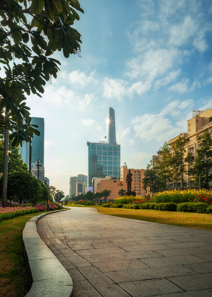 Home Urban landscape with skyscraper and park under a blue sky in daytime, perfect for cityscape themes.